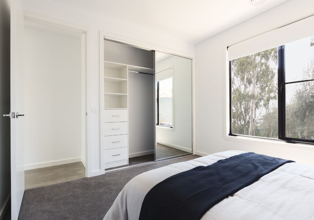 mirrored sliding doors in small bedroom